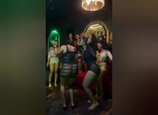Half-naked  girls dancing in a Kenyan nightclub